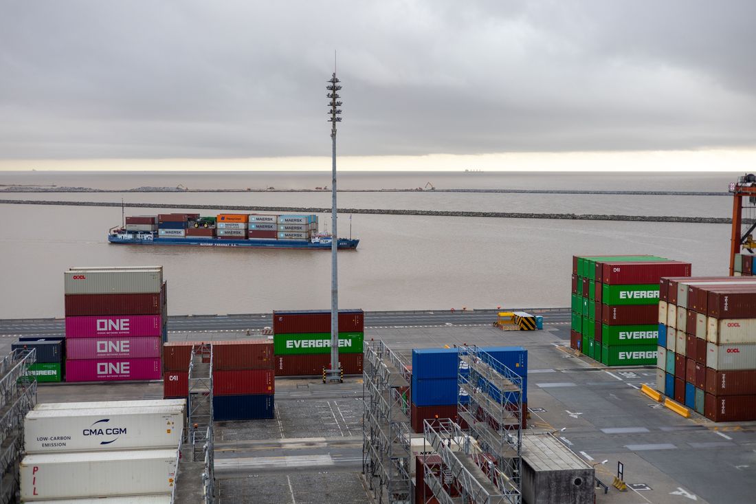 Shipping containers stacked at a port terminal